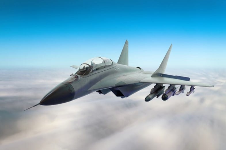 A military jet flying among the clouds